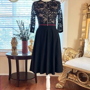 Beautiful Black embroidered dress with strip waistband.